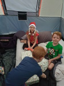 Kids on airbeds while camping in tent